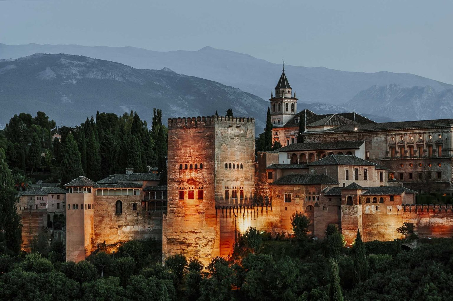 Granada, Spain - Beautiful night view of Alhambra Palace illuminated at dusk